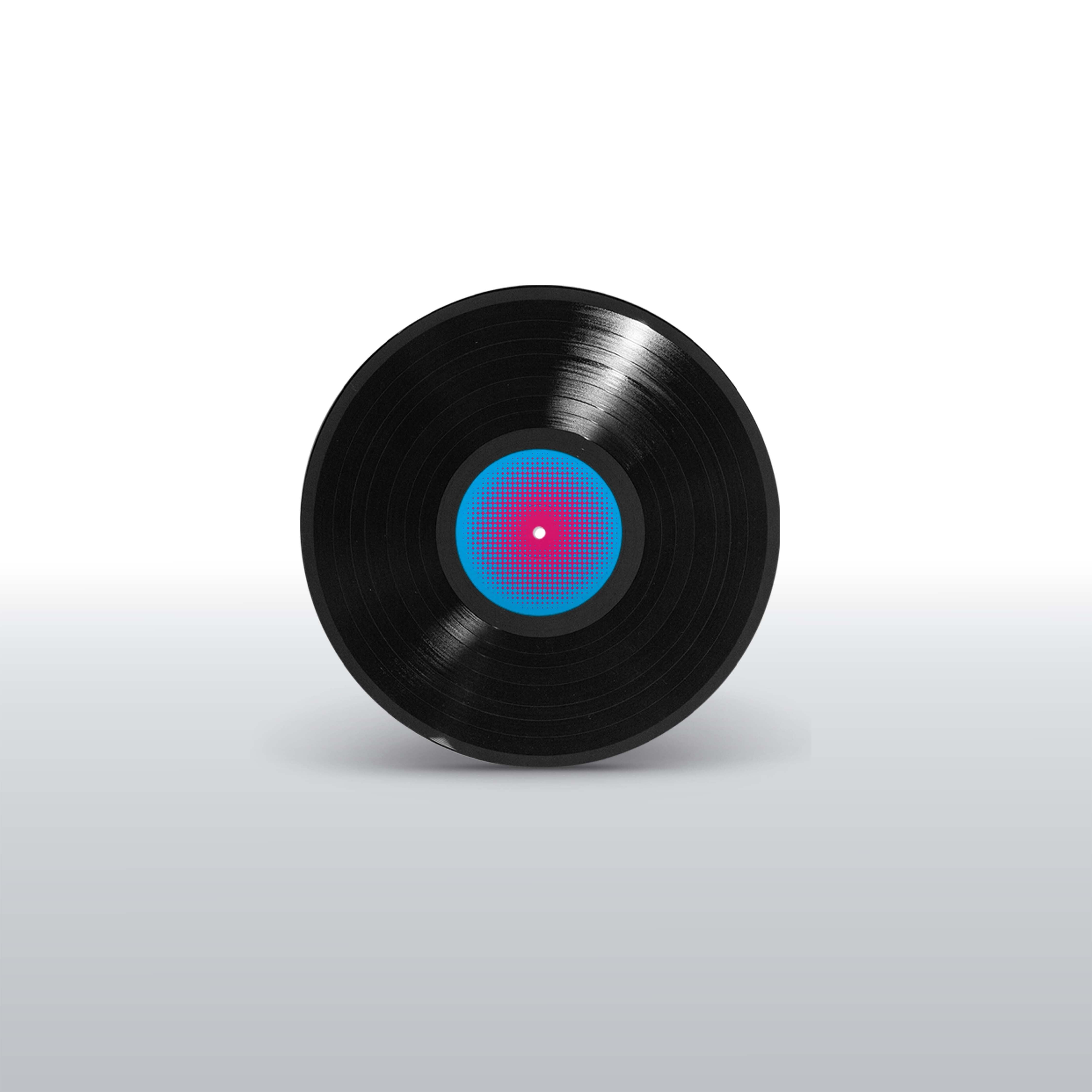 Disco de vinil preto do LP Hermeto Pascoal & Grupo com rótulo central azul e rosa em padrão de pontos (disco de vinil).