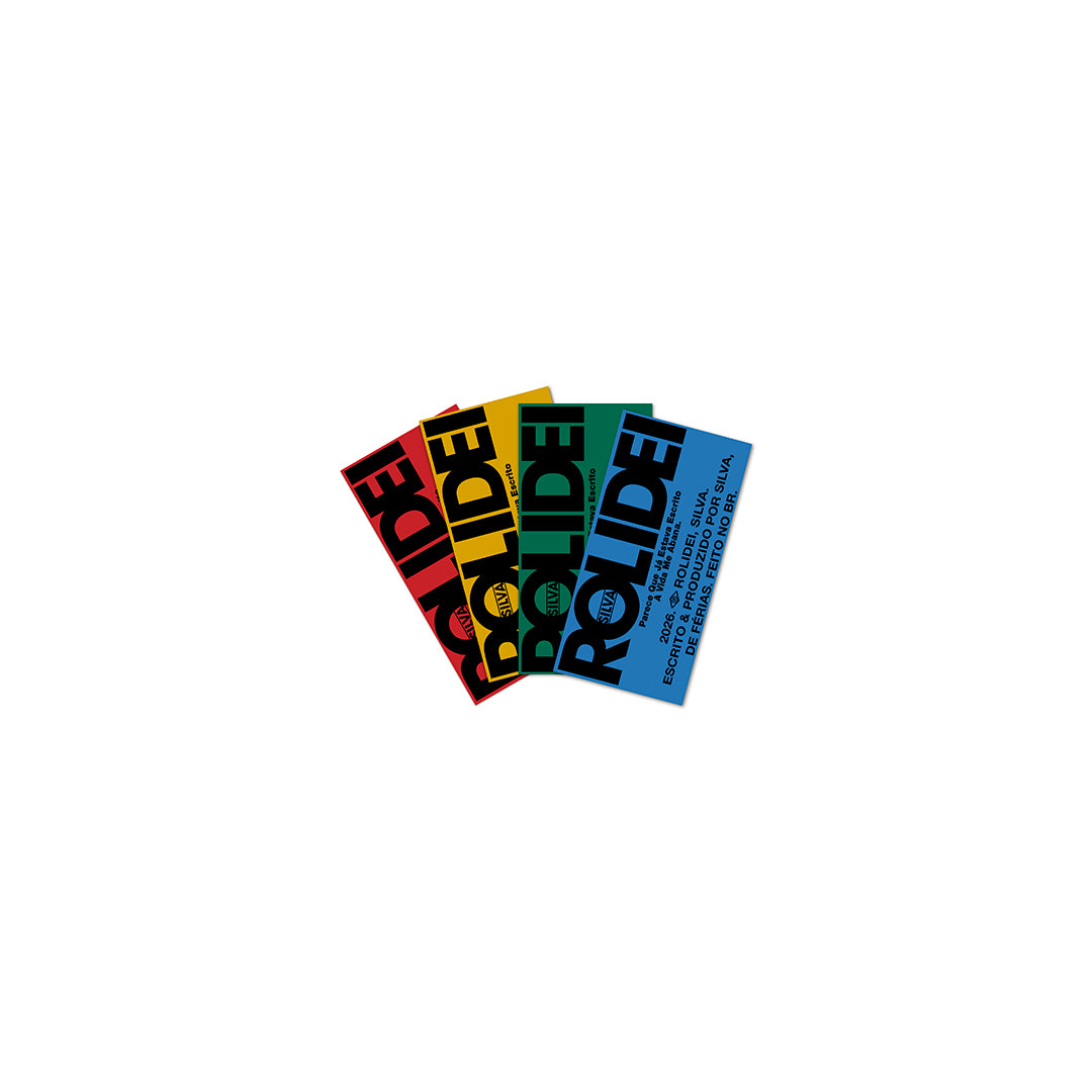 Conjunto de adesivos coloridos do álbum “Rolidei” do artista Silva em formato disco de vinil, com variações tipográficas do título do álbum em vermelho, amarelo, verde e azul (disco de vinil).